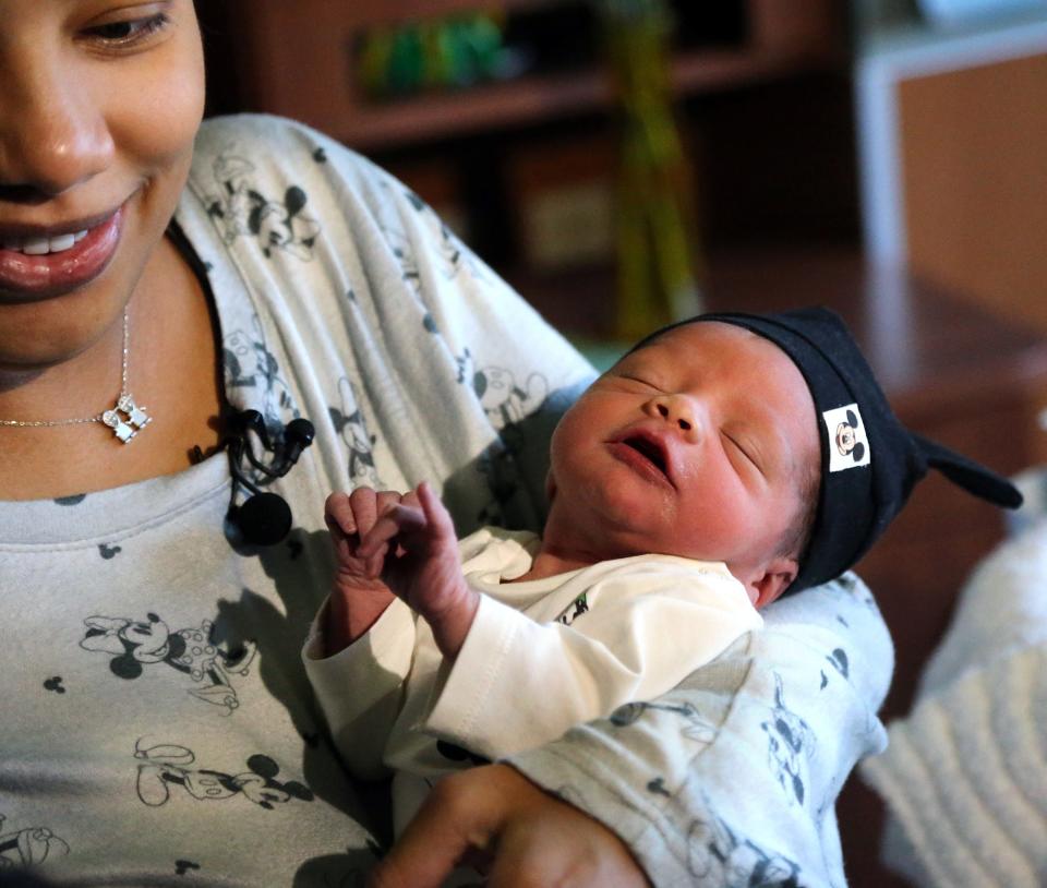 Tiago Gonzalez rests in the arms of his mother, Rochela, at Wentworth-Douglass Hospital in Dover Friday, Sept. 16, 2022.