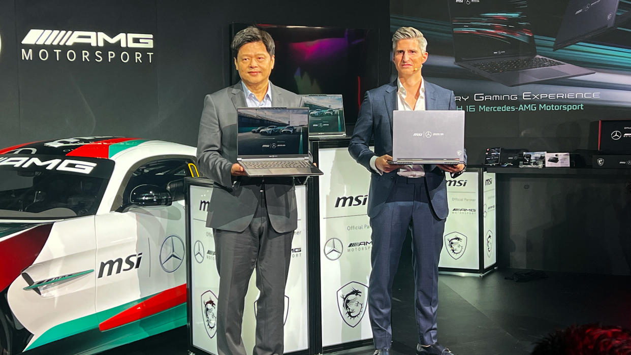  MSI and Mercedes-AMG Motorsport executives showing off the MSI Stealth 16 Mercedes-AMG Motorsport laptop 