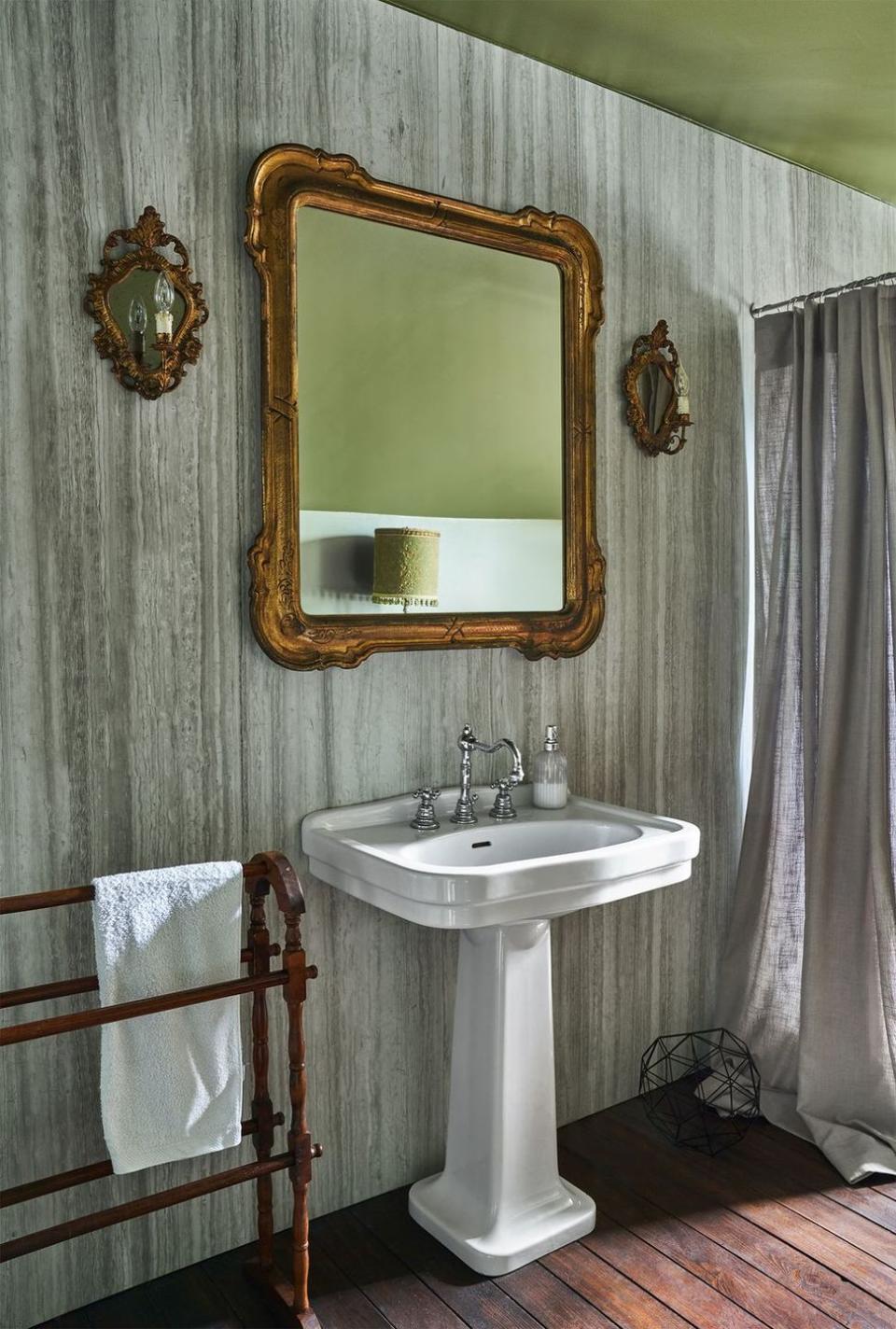 a bathroom with a mirror and a sink