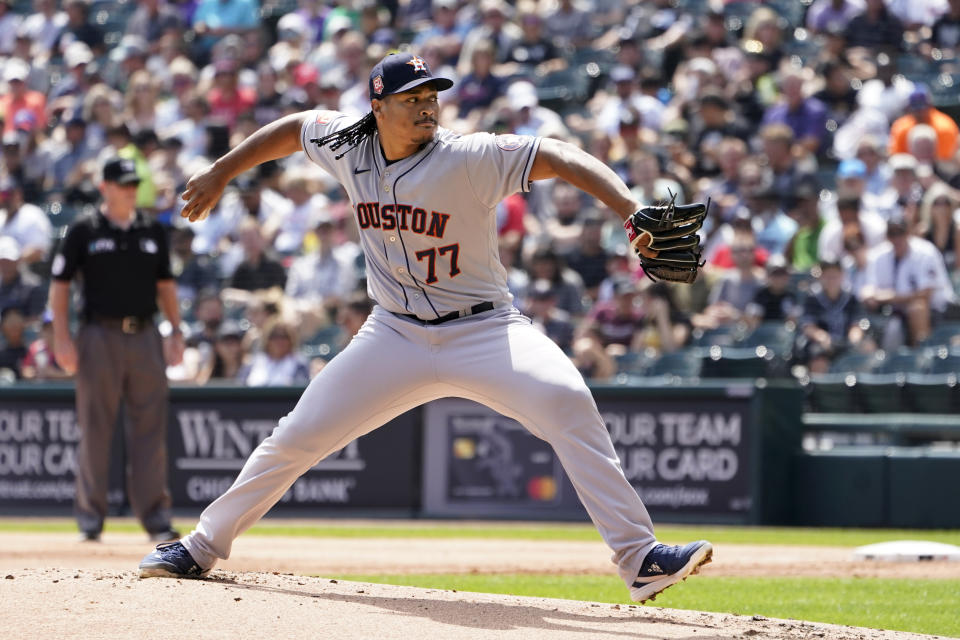 Houston Astros starting pitcher Luis Garcia winds up during the first inning of a baseball game against the Chicago White Sox Thursday, Aug. 18, 2022, in Chicago. (AP Photo/Charles Rex Arbogast)