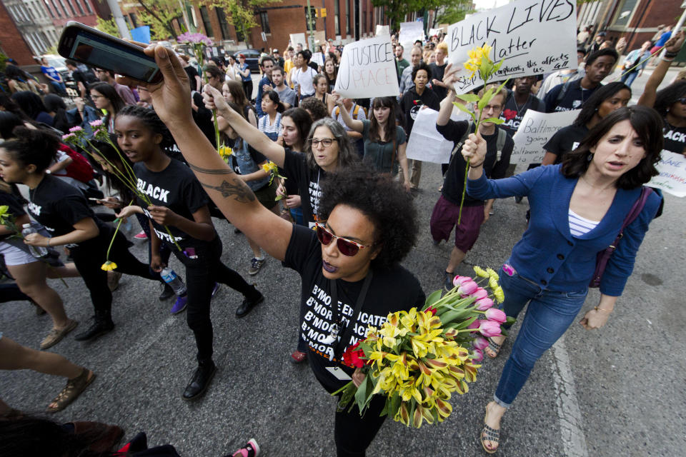 FILE - Protestors march on April 29, 2015, in Baltimore. Hundreds of protesters, many of them students wearing backpacks, marched through downtown, calling for swift justice in the case of Freddie Gray, a Black man who died after suffering a severe spinal cord injury inside a police van. (AP Photo/Matt Rourke, File)