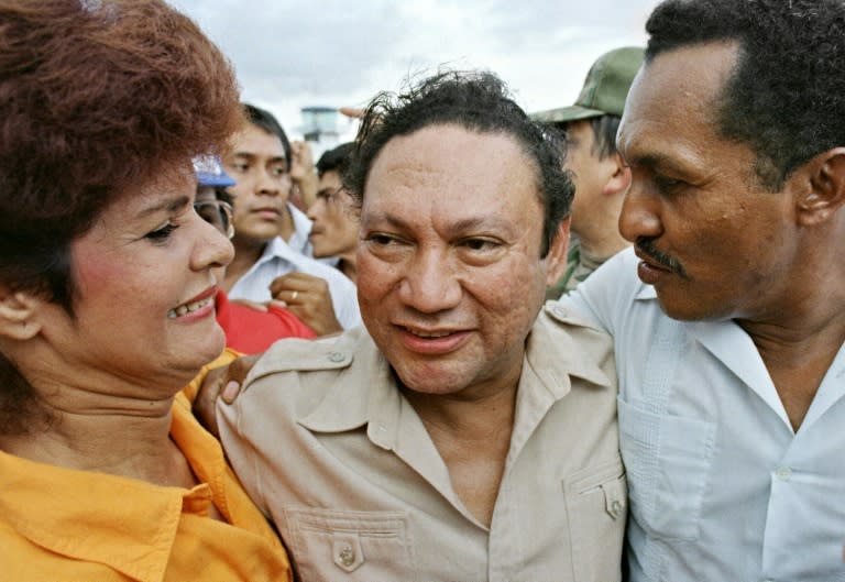 Panamanian dictator Manuel Antonio Noriega hugs supporters on a visit to a remote town in June 1987