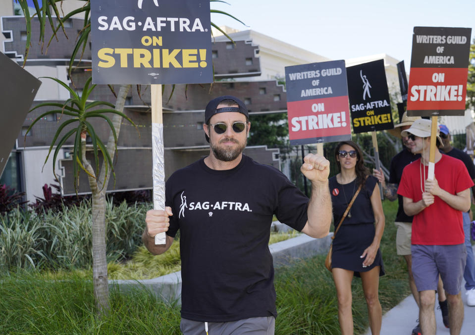 Chris Witaske walks on a picket line outside Netflix studios on Thursday, July 20, 2023, in Los Angeles. The actors strike comes more than two months after screenwriters began striking in their bid to get better pay and working conditions. (AP Photo/Chris Pizzello)