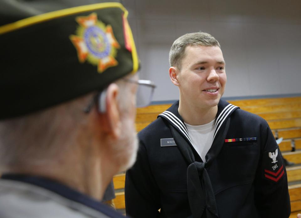 Navy veteran Mike St. Pierre of Berwick listens to Navy Petty Officer Second Class John Maier on Thursday, Nov. 9, 2023 at Great Works School.