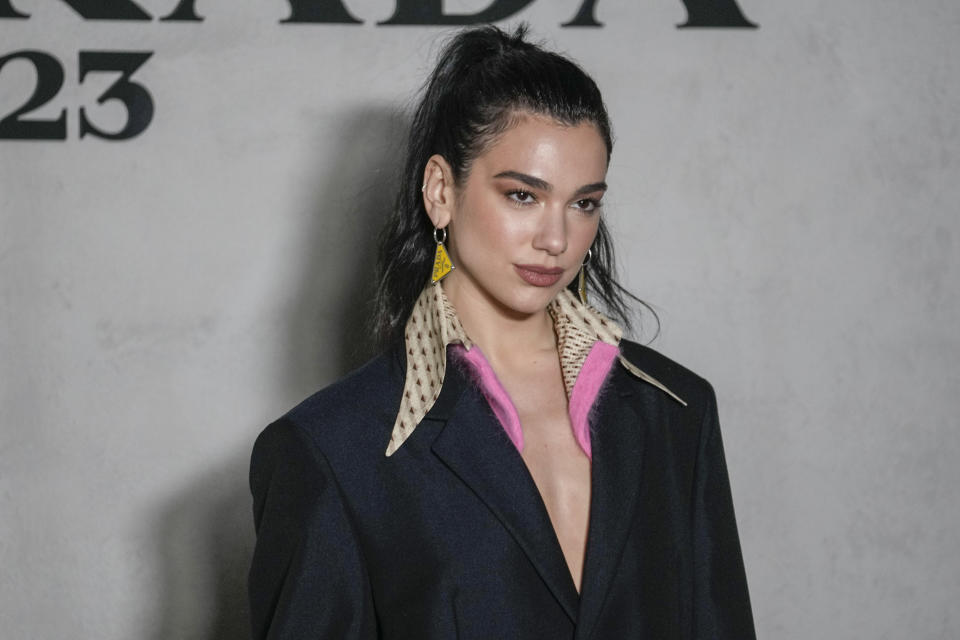 Dua Lipa arrives at the Prada women's Fall-Winter 2023-24 collection presented in Milan, Italy, Thursday, Feb. 23, 2023. (AP Photo/Luca Bruno)