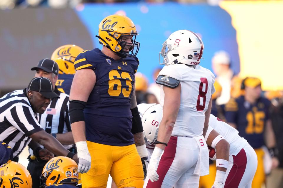 California Golden Bears offensive lineman Brayden Rohme (63) talks to Stanford Cardinal linebacker Tristan Sinclair (8) during a Pac-12 game on Nov. 19, 2022.