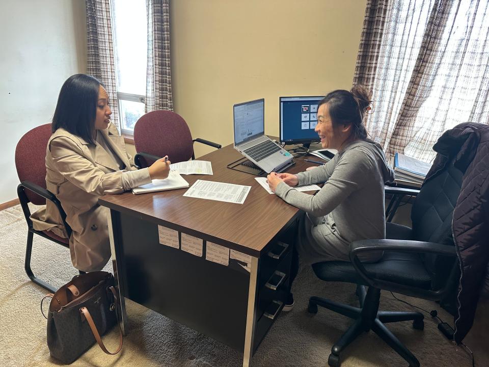 Amy Moua visits with Choua Lee, program counselor with Lakeshore Technical College, to discuss returning to Lakeshore to complete her health information management degree. Lee is available at the Hmong Mutual Assistance Association of Sheboygan on Wednesdays.