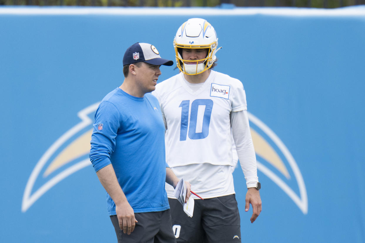 Los Angeles Chargers offensive coordinator Kellen Moore (left) is hoping to take his unit to new heights with Justin Herbert already showing strong command of the system. (AP Photo/Jae C. Hong)