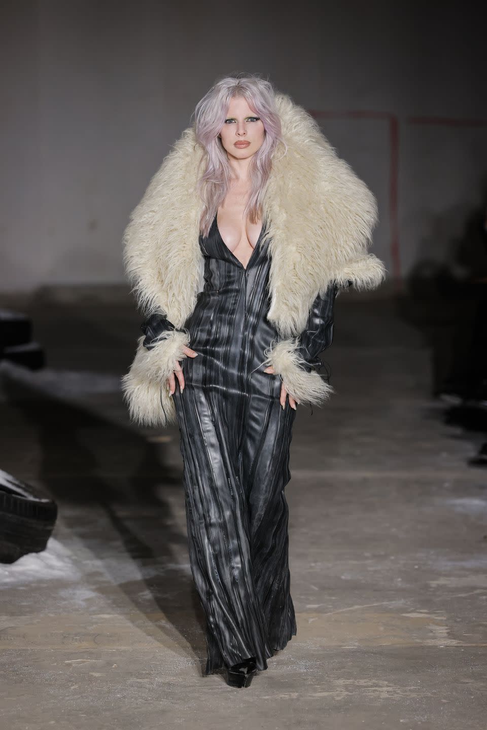 julia fox walks the pressiat aw24 runway during paris fashion week wearing a xl fur collar and plunging dress