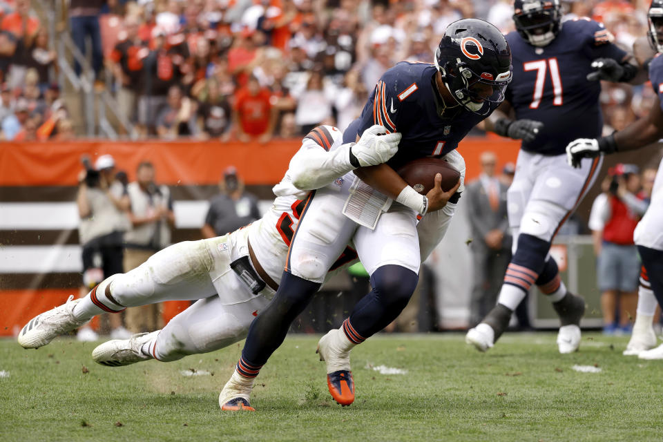 Chicago Bears quarterback Justin Fields (1) is sacked by Cleveland Browns defensive end Myles Garrett (95). (AP Photo/Kirk Irwin)