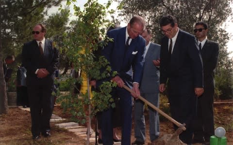 Prince Philip plants a tree in memory of his mother Princess Alice of Greece on the Avenue of the Righteous Among Nations in Jerusalem - Credit: AP