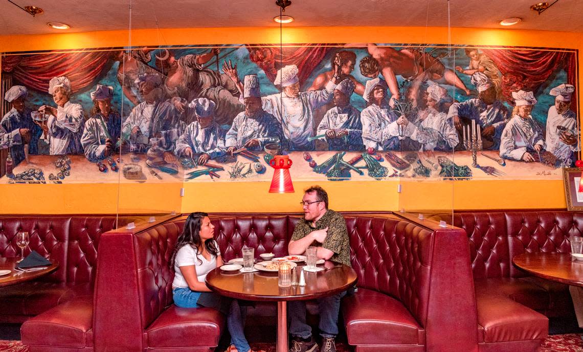 The large mural in the dining room of Jasper’s Italian Restaurant shows generations of owners and chefs.