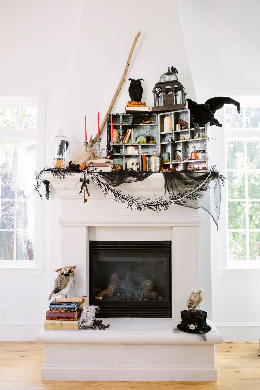 <p>Draw the eye up on your fireplace mantel by decorating with themed objects, like broomsticks and witches' hats. Get the tutorial at <a href="http://handmademood.com/a-step-by-step-guide-to-decorating-your-mantle/" rel="nofollow noopener" target="_blank" data-ylk="slk:Handmade Mood;elm:context_link;itc:0;sec:content-canvas" class="link ">Handmade Mood</a>.</p><p><a class="link " href="https://www.amazon.com/Touch-Nature-21722-1-Piece-Feather/dp/B008H55WIA/ref=sr_1_4?tag=syn-yahoo-20&ascsubtag=%5Bartid%7C10057.g.2554%5Bsrc%7Cyahoo-us" rel="nofollow noopener" target="_blank" data-ylk="slk:BUY NOW;elm:context_link;itc:0;sec:content-canvas">BUY NOW</a> <strong><em>Faux Flying Crow, $9</em></strong></p>