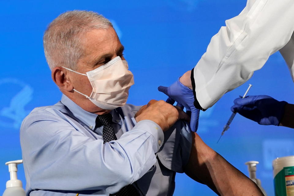 Dr. Anthony Fauci, director of the National Institute of Allergy and Infectious Diseases, prepares to receive his first dose of the new Moderna COVID-19 vaccine at the National Institutes of Health, in Bethesda, U.S., December 22, 2020. Patrick Semansky/Pool via REUTERS