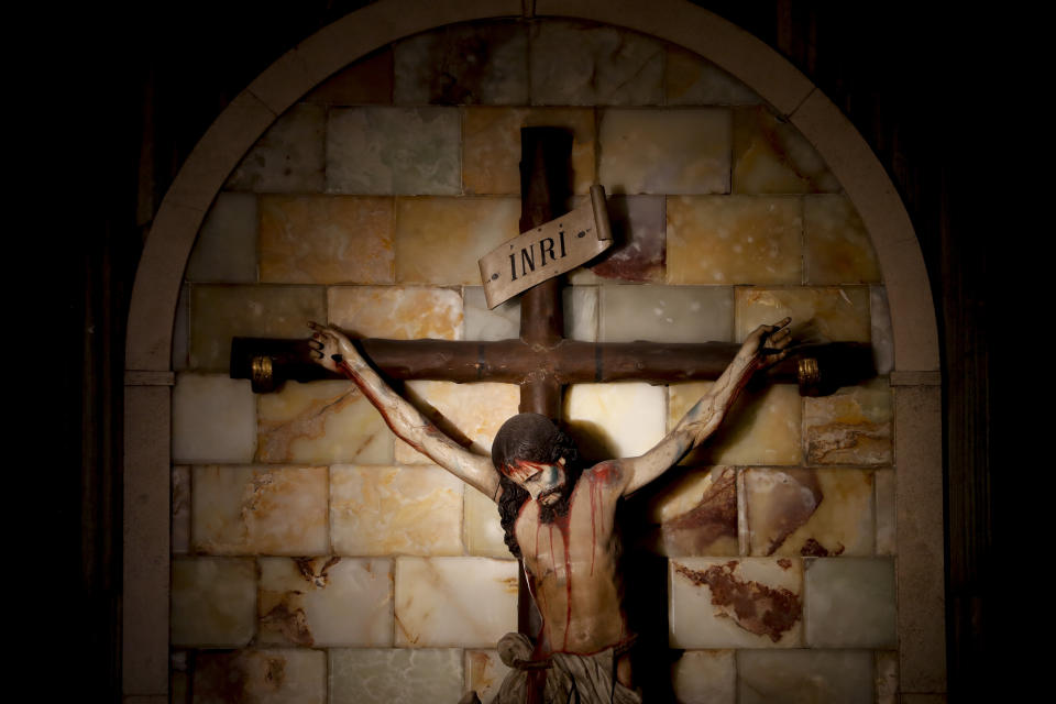 This Aug. 1, 2019 photo shows a statue of a crucified Jesus Christ inside the Sacred Heart Catholic church in Mendoza, Argentina. On Monday, Aug. 5, 2019, two Roman Catholic priests go on trial in his province of Mendoza, charged with 28 alleged crimes against 10 deaf minors and face prison sentences of up to 20 years. (AP Photo/Natacha Pisarenko)