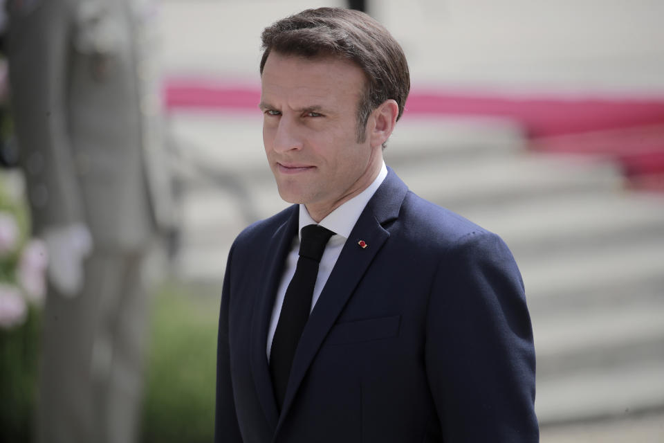 French President Emmanuel Macron reviews military troops during the ceremony of his inauguration for a second term at the Elysee palace, in Paris, France, Saturday, May 7, 2022. Macron was reelected for five years on April 24 in an election runoff that saw him won over far-right rival Marine Le Pen. (AP Photo/Lewis Joly)