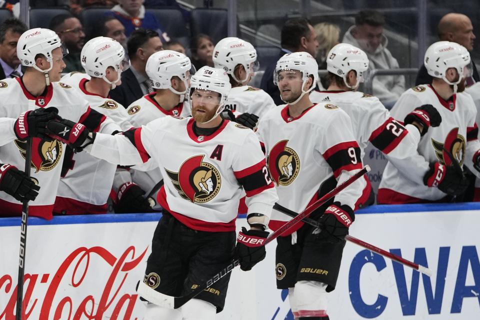 Ottawa Senators' Claude Giroux (28) and Josh Norris (9) celebrate with teammates after Giroux scored against the New York Islanders during the second period of an NHL hockey game Thursday, Oct. 26, 2023, in Elmont, N.Y. (AP Photo/Frank Franklin II)