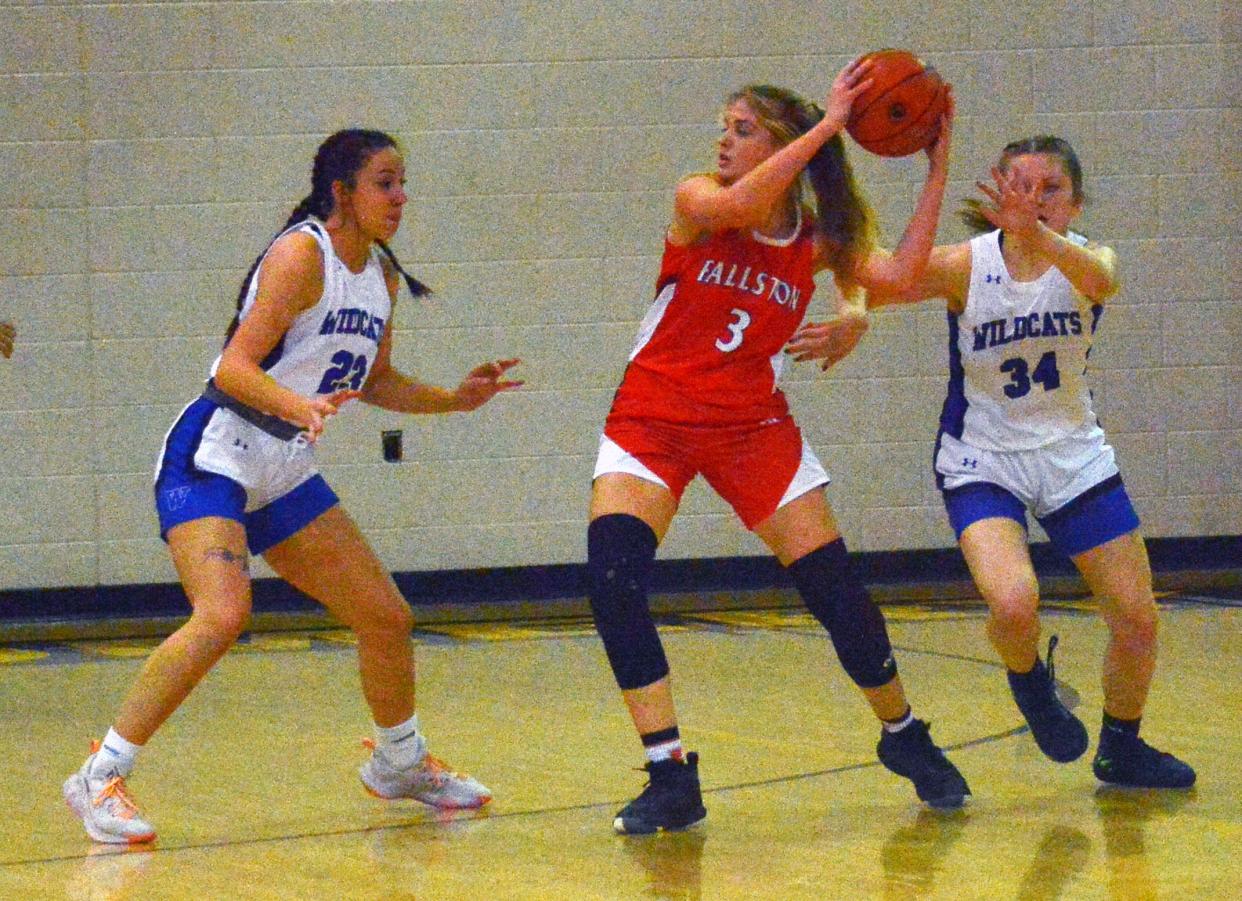 Williamsport's Olivia Frye (23) and Mackenzie Kloos (34) set the trap in an attempt to steal the ball from Fallston's Allie Book.