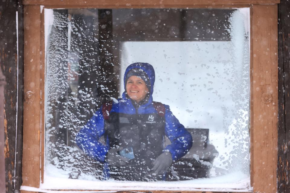 A woman waits in a bus stop as a blizzard hits Mammoth Lakes in the Eastern Sierra Nevadas of California, on March 2, 2024. The National Weather Service has issued a blizzard warning for California's entire Sierra Nevada through early March 3, 2024. Forecaster report the storm could bring three to five inches (8 to 13cms) of snow per hour. (Photo by DAVID SWANSON / AFP) (Photo by DAVID SWANSON/AFP via Getty Images) ORG XMIT: 776114505 ORIG FILE ID: 2046558584