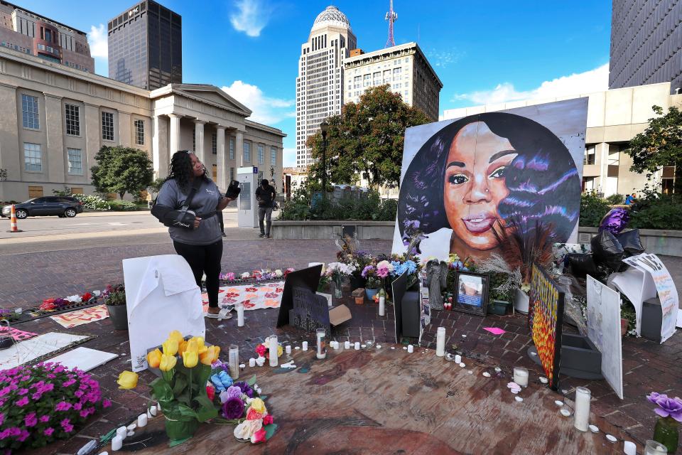 Tamika Palmer admired a large painting of her slain daughter, Breonna Taylor, that is displayed inside Breonna's Circle at Jefferson Square Park on Aug. 5 2020.  She died at the hands of LMPD as they issued a no-knock warrant at her apartment.