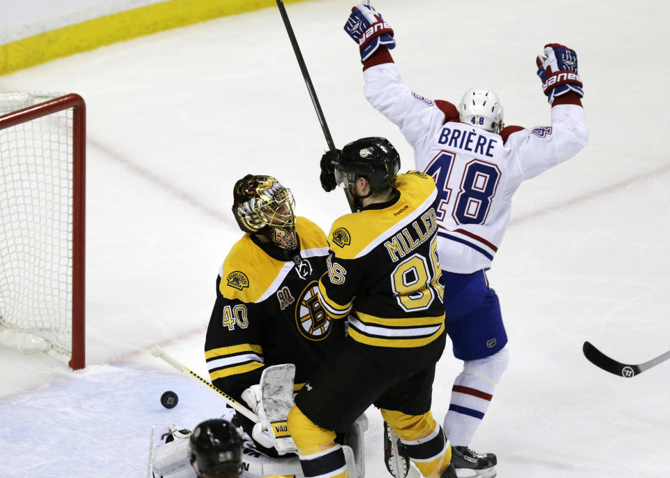 Montreal Canadiens center Daniel Briere (48) raises his arms after teammate P.K. Subban's goal off Boston Bruins goalie Tuukka Rask (40) during the first period of Game 1 in the second-round of the Stanley Cup playoff series in Boston, Thursday, May 1, 2014. (AP Photo/Charles Krupa)