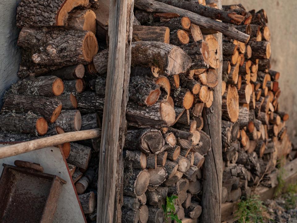 stack of unused wood in someone's backyard