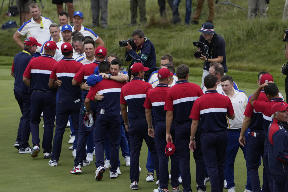 Team USA shakes hands with Team Europe after the Ryder Cup matches at the Whistling Straits Golf Course Sunday, Sept. 26, 2021, in Sheboygan, Wis. (AP Photo/Jeff Roberson)