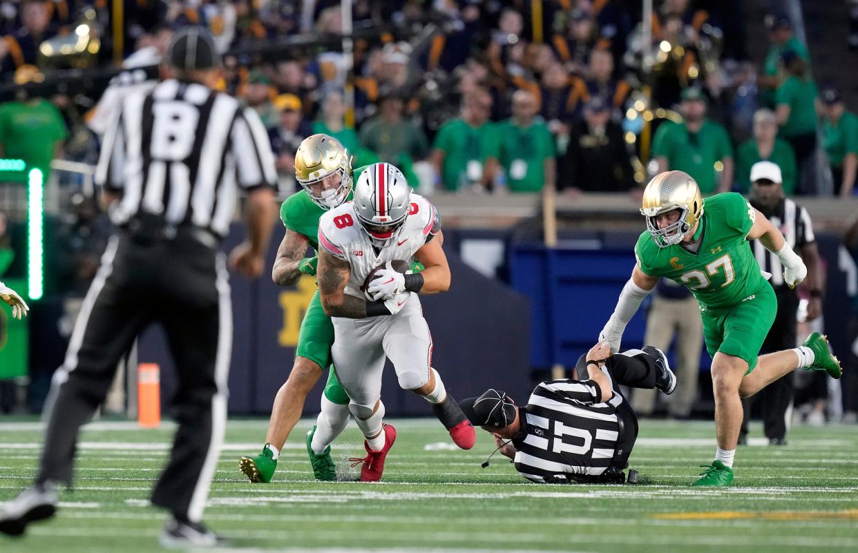 Ohio State tight end Cade Stover makes a catch in front of an official during Saturday's 17-14 win over Notre Dame.