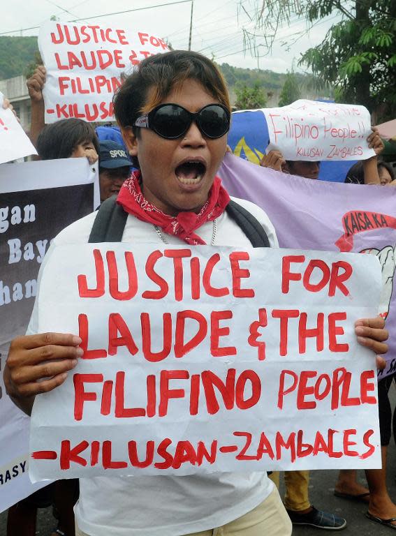 Protesters rally near the court building in the Philippine city of Olongapo, on March 23, 2015