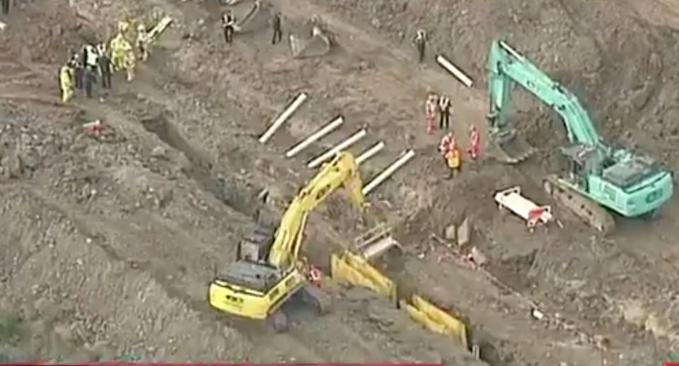 Emergency services were called to the worksite at Wallan on Thursday about 3pm after reports a worker had fallen down a six-metre deep trench. Source: 7 News