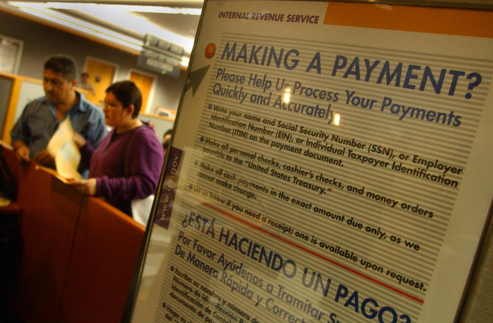 People wait to get assistance at the IRS service center office, in downtown L.A.  (Photo by Richard Hartog/Los Angeles Times via Getty Images)