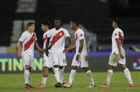 Players or Peru reacts after losing 4-0 against Brazil during a Copa America soccer match at Nilton Santos stadium in Rio de Janeiro, Brazil, Thursday, June 17, 2021. (AP Photo/Silvia Izquierdo)