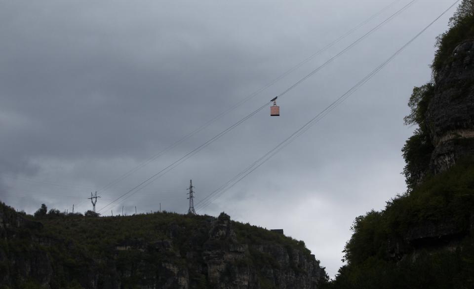 A cable car travels above the town of Chiatura