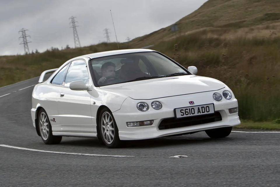 <p>Described by many as the best-handling front-wheel drive car ever made; the Integra Type R was the benchmark for Type Rs that would follow for years to come. The large rear wing reduced lift by 30 percent while an aero lip at the front kept things stable at higher speeds. Its chassis had a reinforced subframe and additional spot welds to boost rigidity, 15in alloys helped the double-wishbone suspension to find its flow and the windscreen was 10 per cent thinner to help keep weight low.</p>