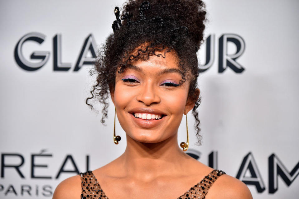 Yara smiling on the red carpet with her hair up