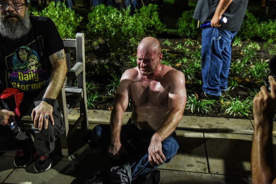 <div class="inline-image__caption"><p>Christopher Cantwell recovers from being pepper-sprayed as he and other white nationalists participate in a torch-lit march on the grounds of the University of Virginia ahead of the Unite the Right Rally in Charlottesville, Virginia on August 11, 2017. Picture taken August 11, 2017.</p></div> <div class="inline-image__credit">REUTERS/Stephanie Keith</div>