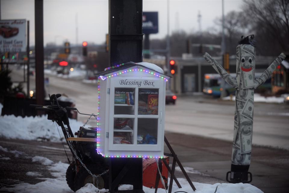 The Blessing Box fill sup each day along 12th Street, just outside Booth 202. December 2021.