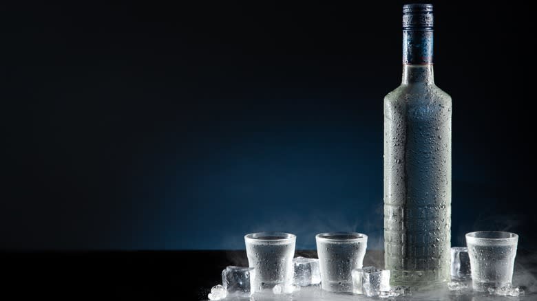 chilled vodka bottle with glasses