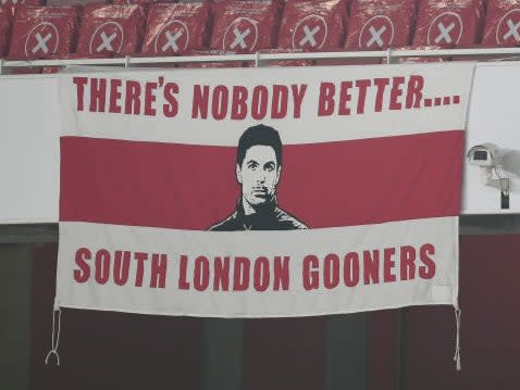 Mikel Arteta banner (Arsenal FC via Getty Images)