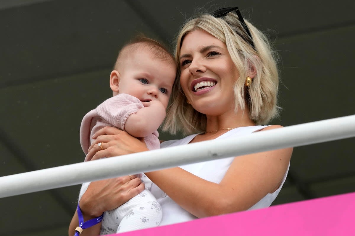 Mollie King cheers on fiancé Stuart Broad with daughter Annabella as he begins his final day of Test cricket (AP)