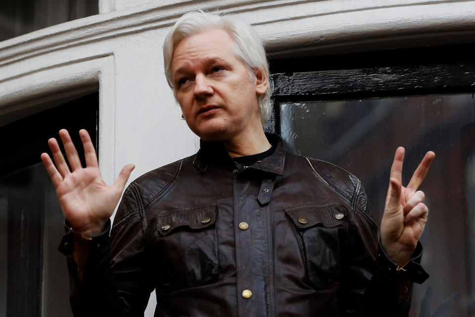 WikiLeaks founder Julian Assange is seen on the balcony of the Ecuadorian Embassy in London in 2017. (Photo: Peter Nicholls/Reuters)