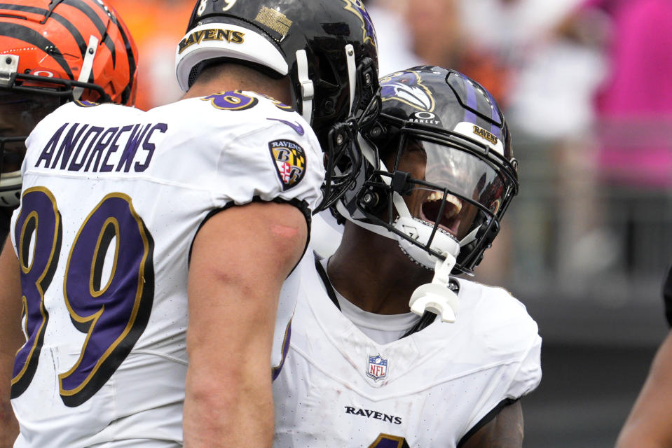 Baltimore Ravens wide receiver Zay Flowers, right, celebrates after catching a pass as teammate Mark Andrews (89) stands by during the second half of an NFL football game against the Cincinnati Bengals Sunday, Sept. 17, 2023, in Cincinnati. (AP Photo/Jeff Dean)