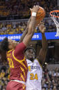 Iowa State's Osun Osunniyi, left, and Missouri's Kobe Brown, right reach for a rebound during the first half of an NCAA college basketball game, Saturday, Jan. 28, 2023, in Columbia, Mo. (AP Photo/L.G. Patterson)