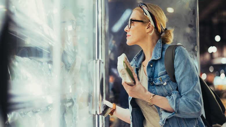 woman looking at frozen foods