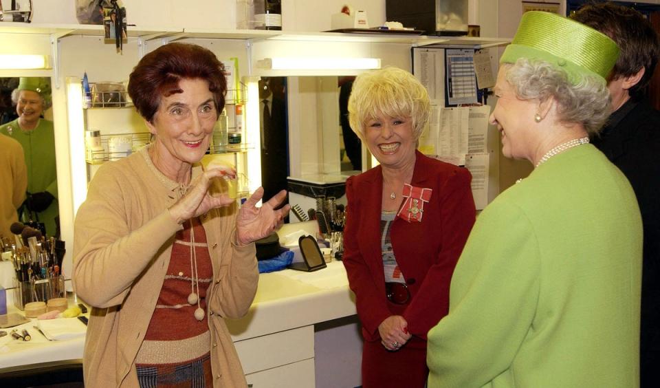 The Queen during her visit to Elstree Studios meeting June Brown and Dame Barbara Windsor in the make-up room (Fiona Hanson/PA) (PA Archive)