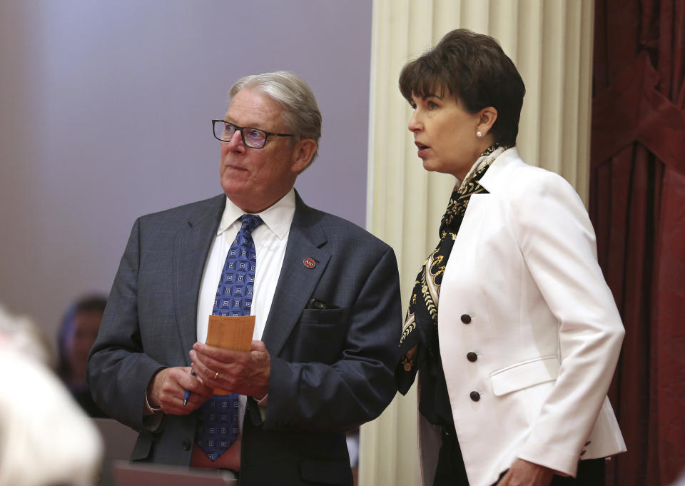 State Sen. Bill Monning, D-Carmel, and Sen. Connie Leyva, D-Chino, watch as the votes are posted for a bill before the Senate Friday, Aug. 31, 2018, in Sacramento, Calif. The Senate approved Leyva's measure requiring all new sexual assault evidence kits to be submitted to a lab with 20 days and tested within 120 days. The bill was sent to Gov. Jerry Brown. (AP Photo/Rich Pedroncelli)