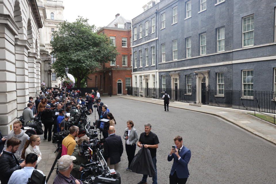 Media gather outside 10 Downing Street, London. Boris Johnson is quitting as Tory leader after ministers and MPs made clear his position was untenable. He will remain as Prime Minister until a successor is in place, expected to be by the time of the Conservative Party conference in October. Picture date: Thursday July 7, 2022. (Photo by James Manning/PA Images via Getty Images)