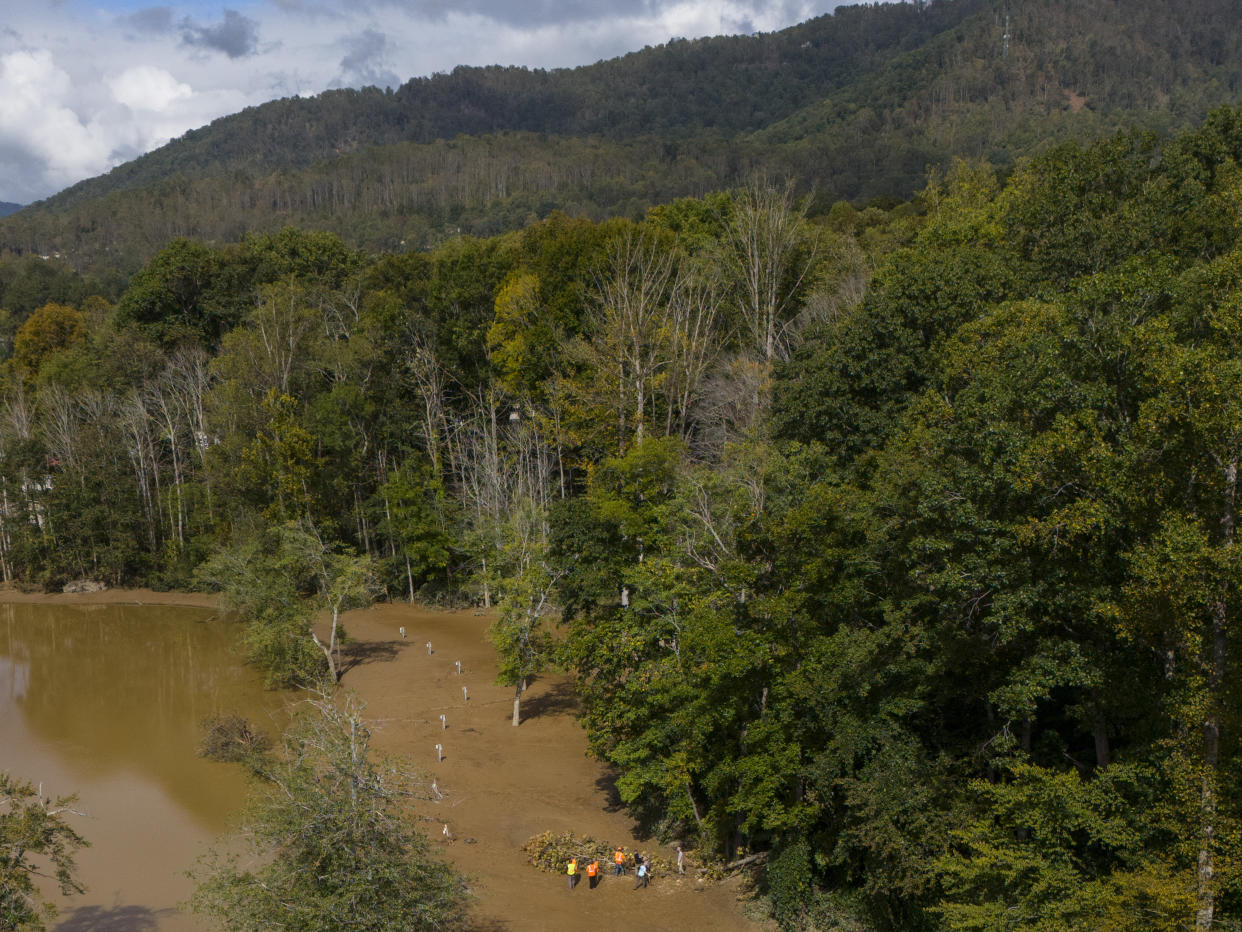 Search crews look for victims in the aftermath of Hurricane Helene, Tuesday, Oct. 1, 2024, in Swannanoa, N.C. (AP Photo/Mike Stewart)