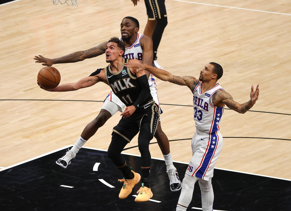 Hawks star Trae Young fights for every inch against the Sixers' defense. (Kevin C. Cox/Getty Images)