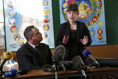 Ex-soldier Rob Lawrie (L) and his lawyer Lucile Abassade attend a news conference in Boulogne-sur-Mer, France, January 14, 2016. REUTERS/Benoit Tessier